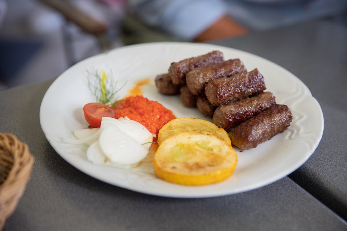Traditional Balkan pastry byrek served with fresh yogurt, a staple Albanian snack