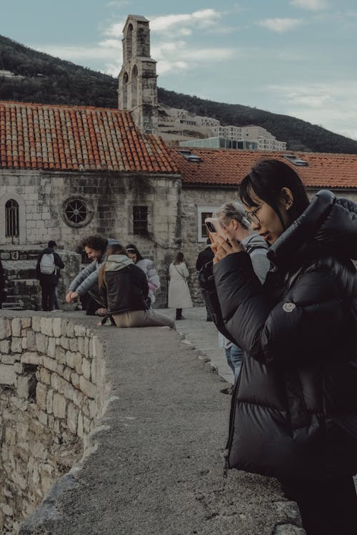 Group of tourists on a guided sightseeing tour exploring a historic site