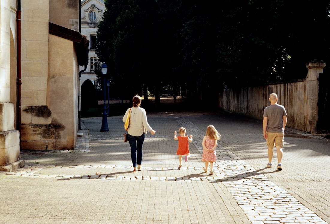 Family reviewing travel plans together, looking at options for a guided tour