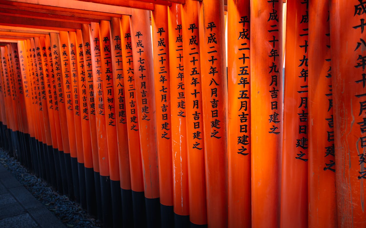 Iconic orange torii gates at Fushimi Inari-taisha shrine in Kyoto, Japan