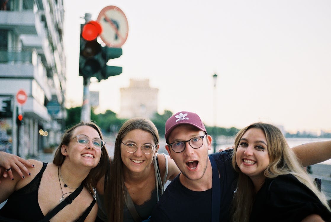 Diverse group of friends smiling and enjoying a day out together, the social experience that defines group travel