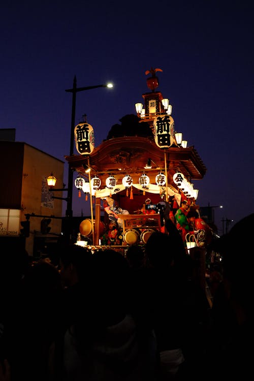 Japan festival float lit up at night during a traditional matsuri
