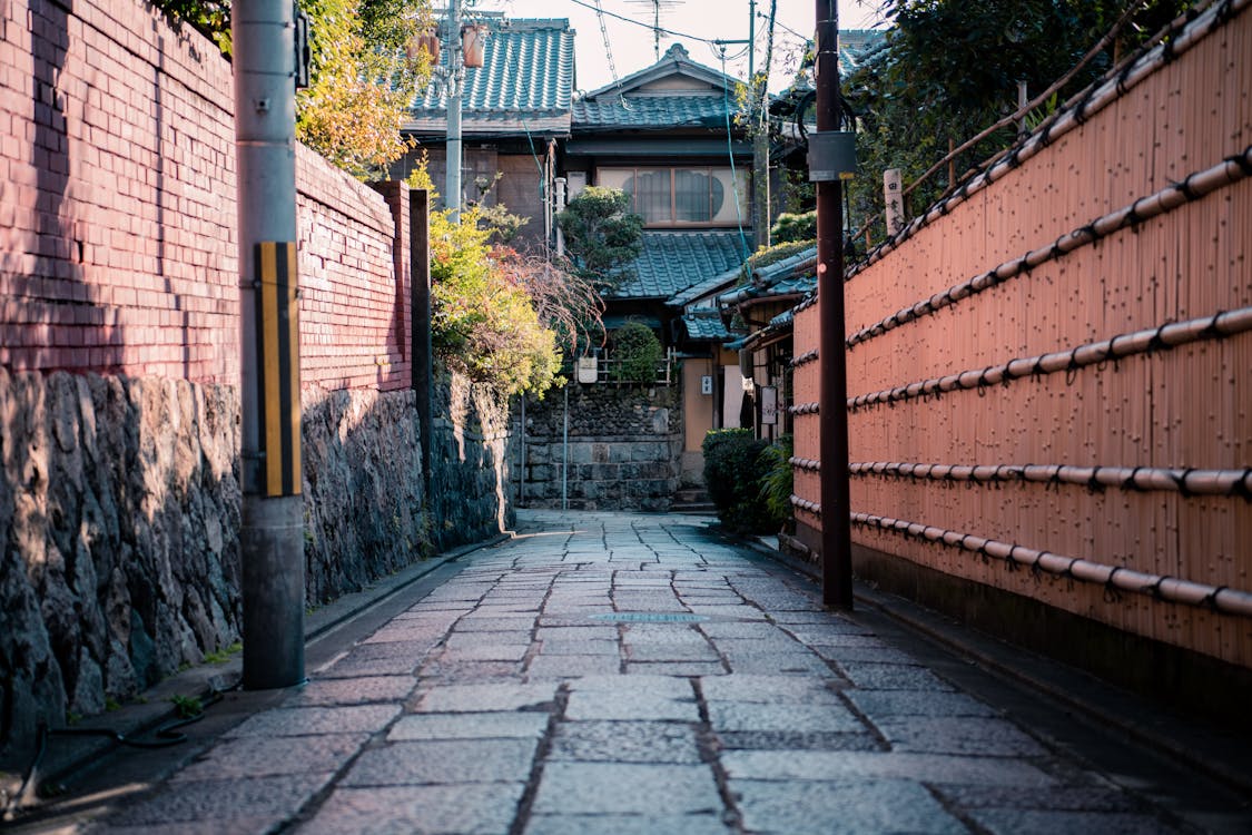 Traditional cobblestone alleyway in Kanazawa, Japan with old wooden architecture