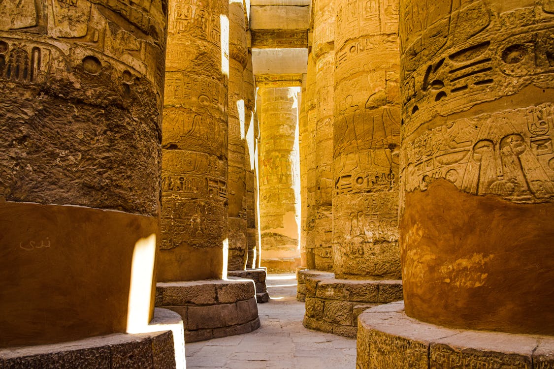 Sunlit ancient columns rising at the Karnak Temple Complex in Luxor, Egypt