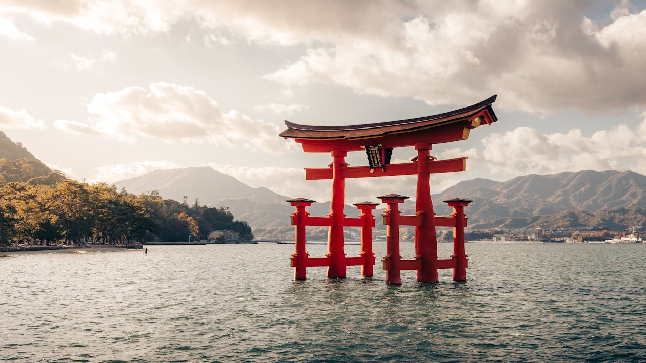 The iconic red floating torii gate of Itsukushima Shrine standing in the sea at Miyajima, Japan