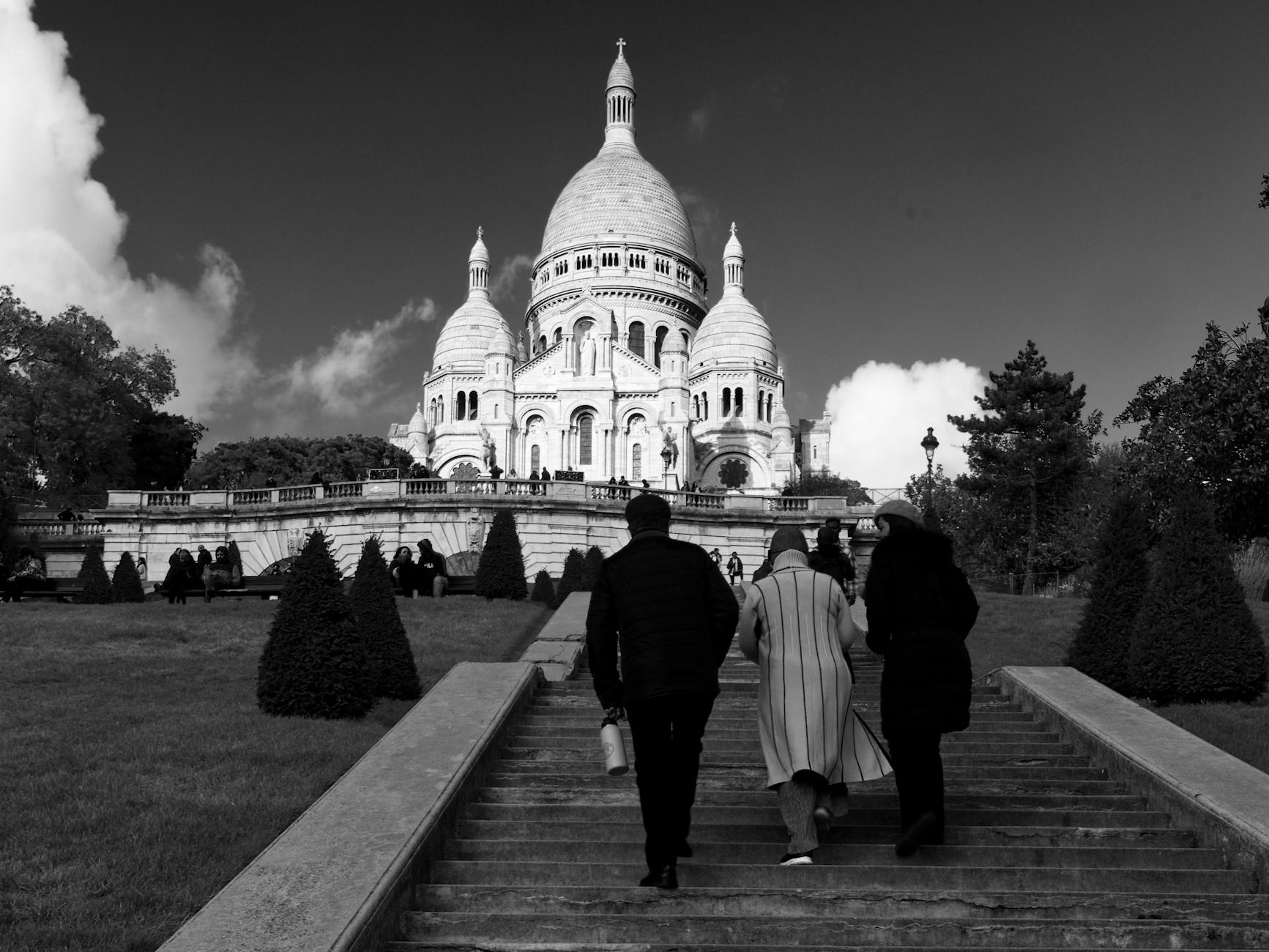 Sacré-Cœur basilica rising above Montmartre cobblestone streets at dawn