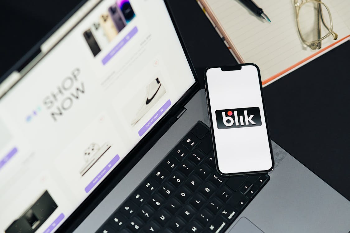 Laptop and smartphone showing a booking interface, the visual shorthand for marketplace comparison