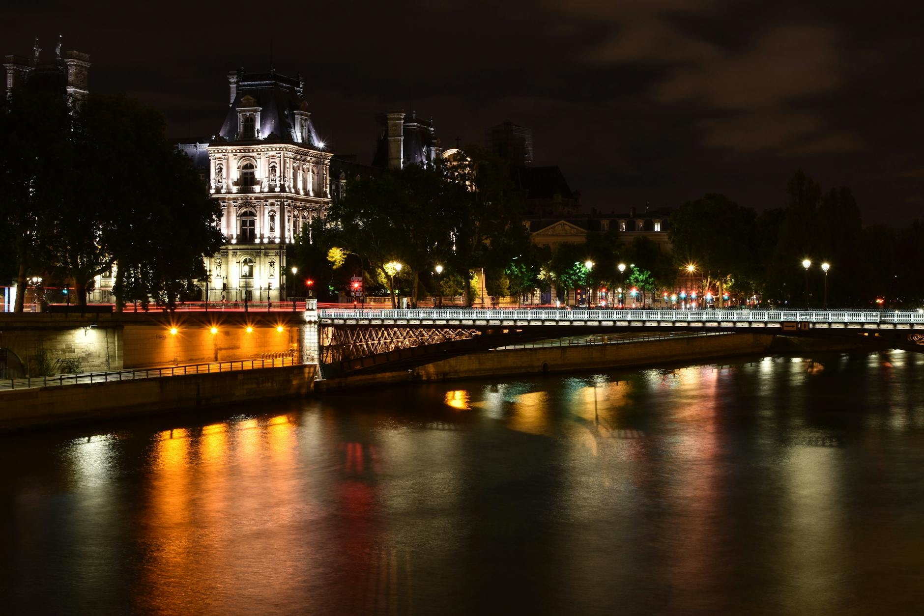 Canal Saint-Martin Paris with iron footbridges and café terraces along the water