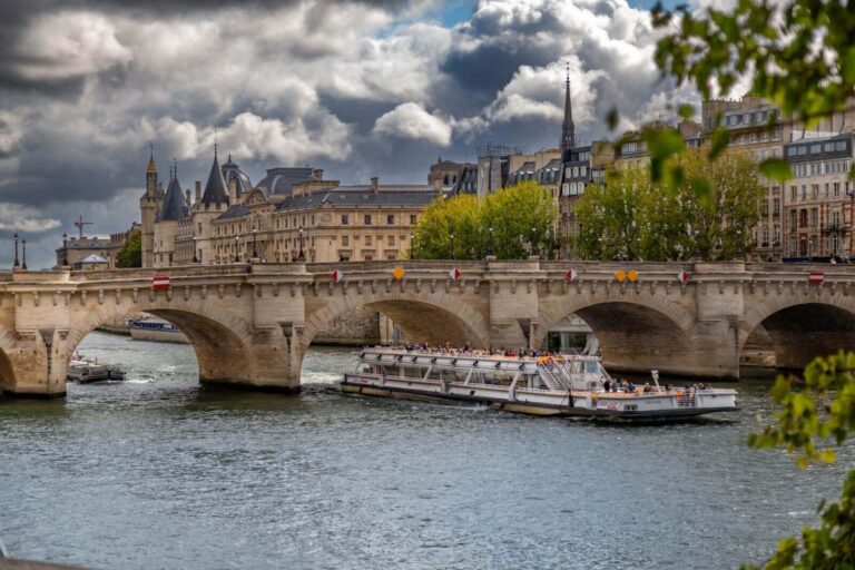 A serene morning on a Seine river cruise ship, with soft sunlight streaming through the windows and passengers enjoying breakfast.