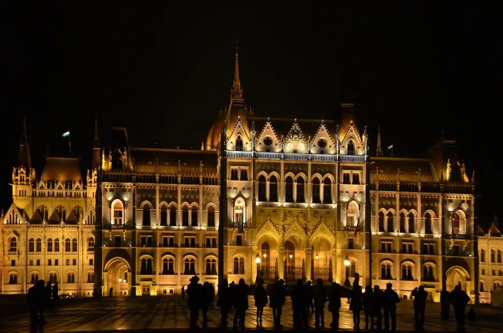 The Parliament building of Budapest illuminated at dusk during a winter evening cruise