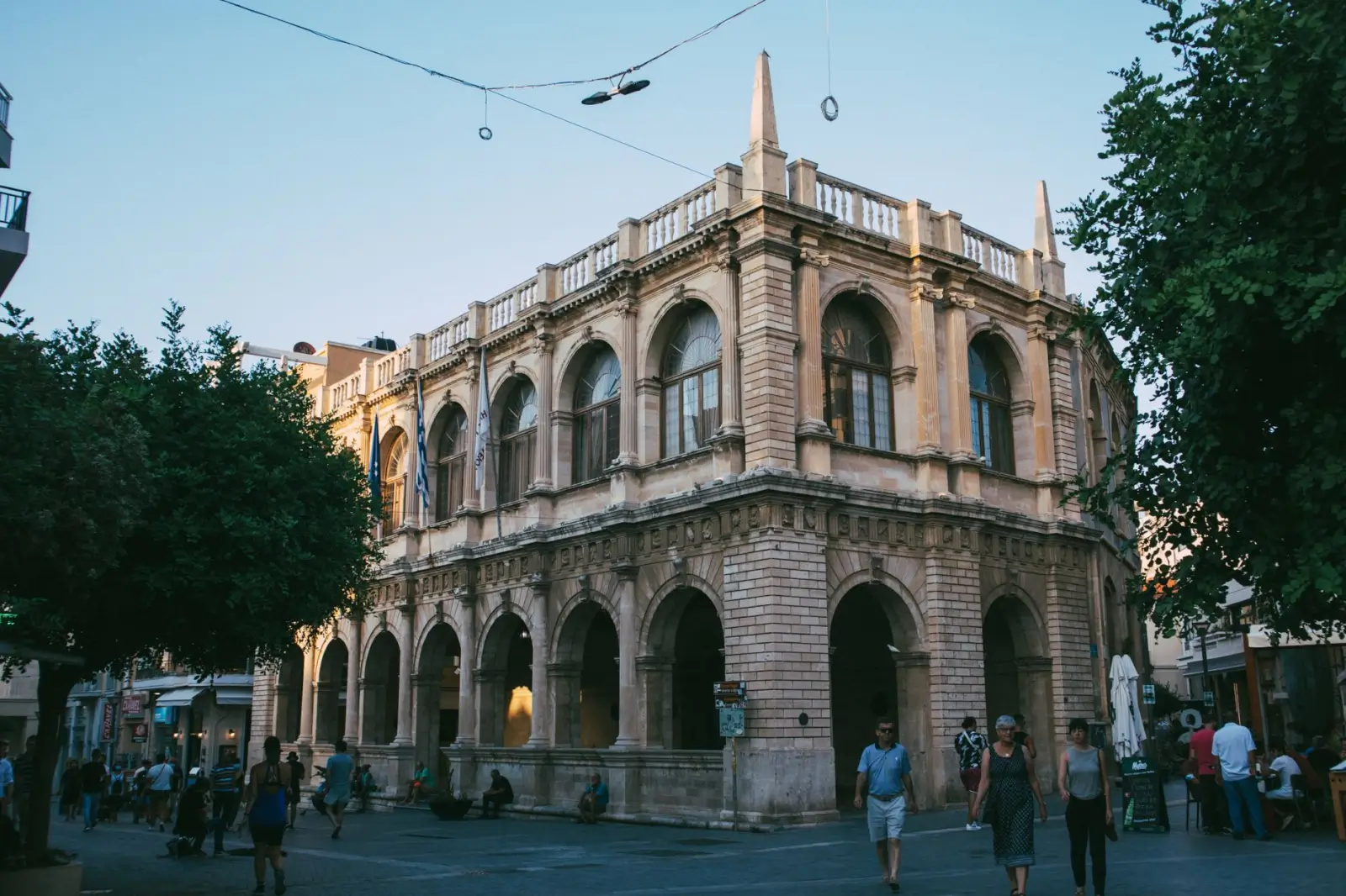 Greece tours in September: Warm seas and calmer post-peak island travel ToursZoom Early morning at a bustling Crete market with fresh produce and local vendors