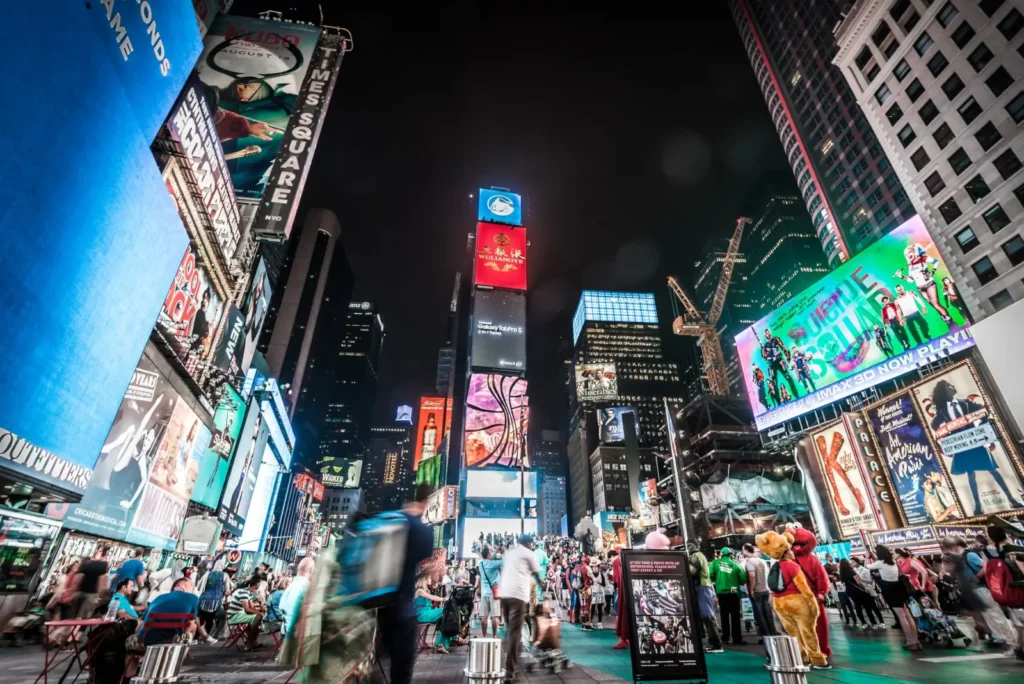 How Tour Marketplaces Work: A Complete Guide for Travelers (2026) ToursZoom The bright lights of Times Square in New York City at night