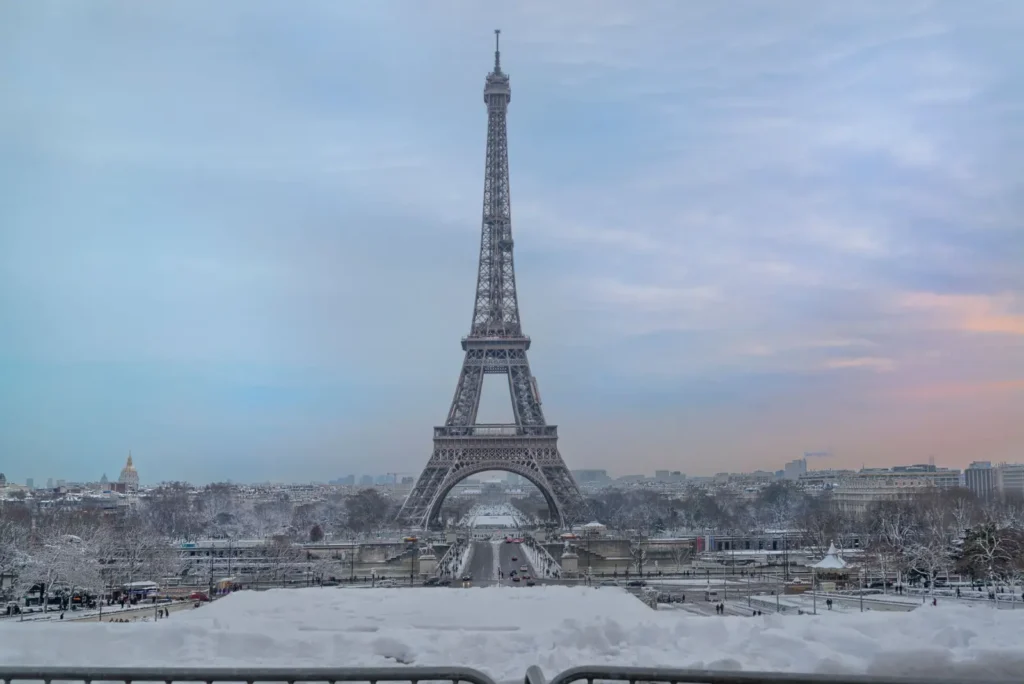How Tour Marketplaces Work: A Complete Guide for Travelers (2026) ToursZoom The Eiffel Tower covered in snow during the Paris winter