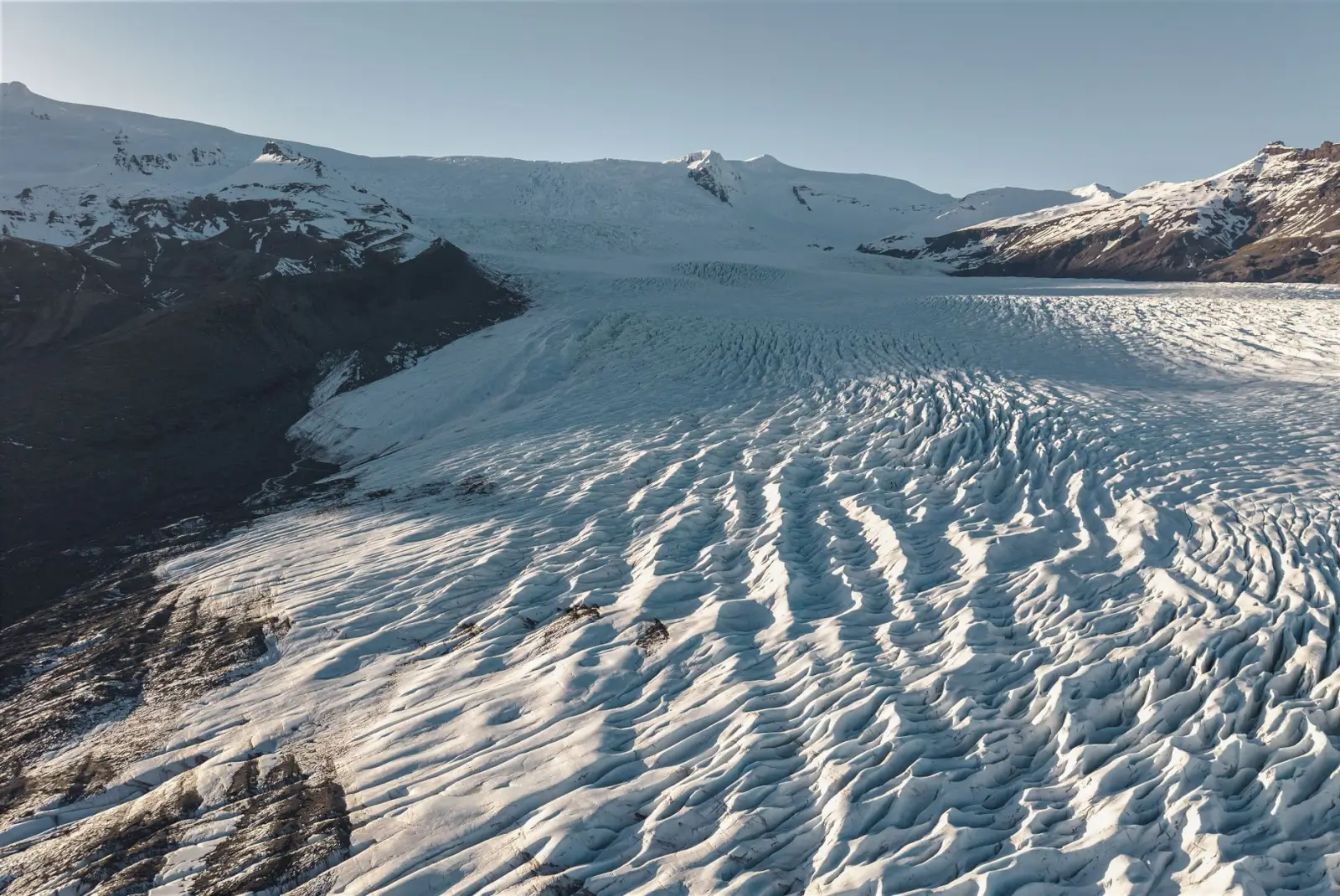 Iceland Adventure Tours: What to Expect When the Weather Doesn't Cooperate ToursZoom The vast Vatnajökull glacier covered in snow and ice, showcasing its expansive and rugged landscape