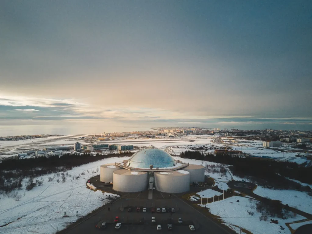 Iceland tours in June: Midnight sun, long drives, and summer touring ToursZoom Golden light illuminating the iconic landmarks of Reykjavik and the Golden Circle at sunset