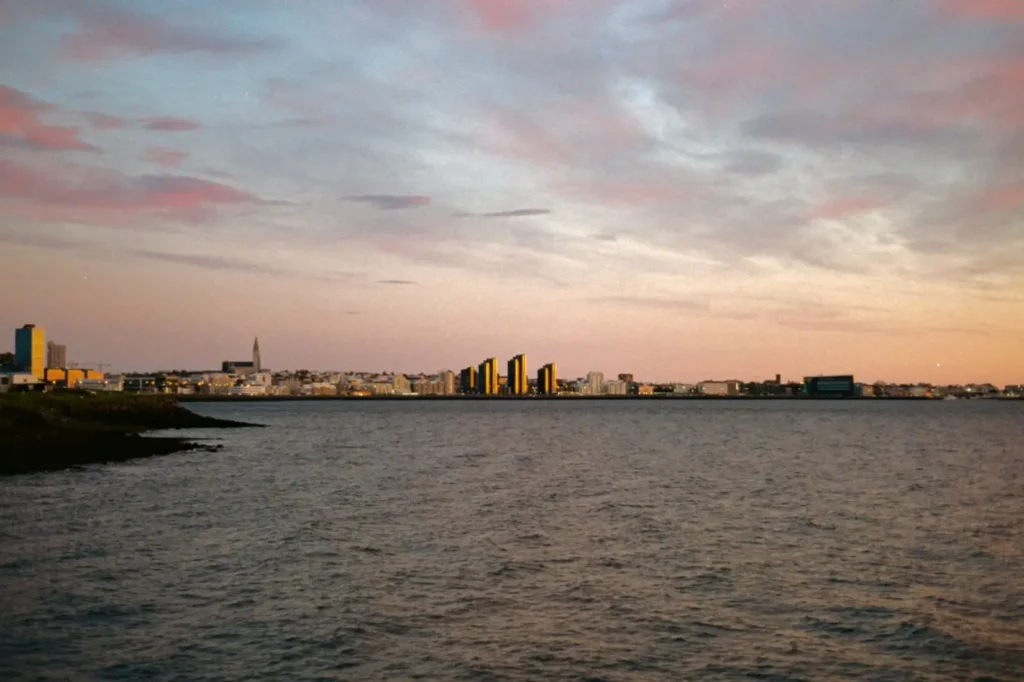 Iceland tours in September: Autumn shoulder season and first northern lights chances ToursZoom Evening view of Reykjavik skyline, showcasing the city's urban charm and lights