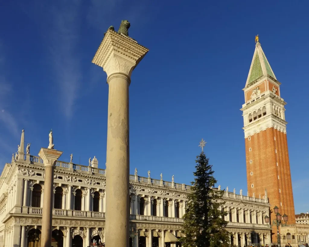 Late afternoon sun casts a golden glow over St. Mark's Square, Venice