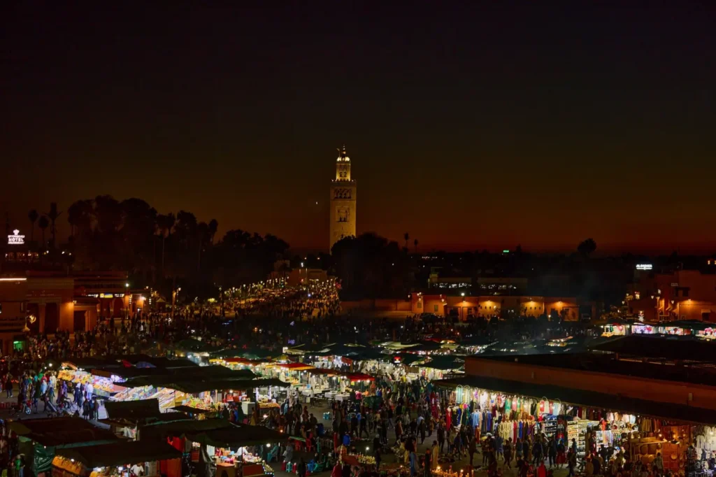 Morocco tours in October: Prime autumn desert and city touring ToursZoom Colorful evening market stalls in Marrakech's medina