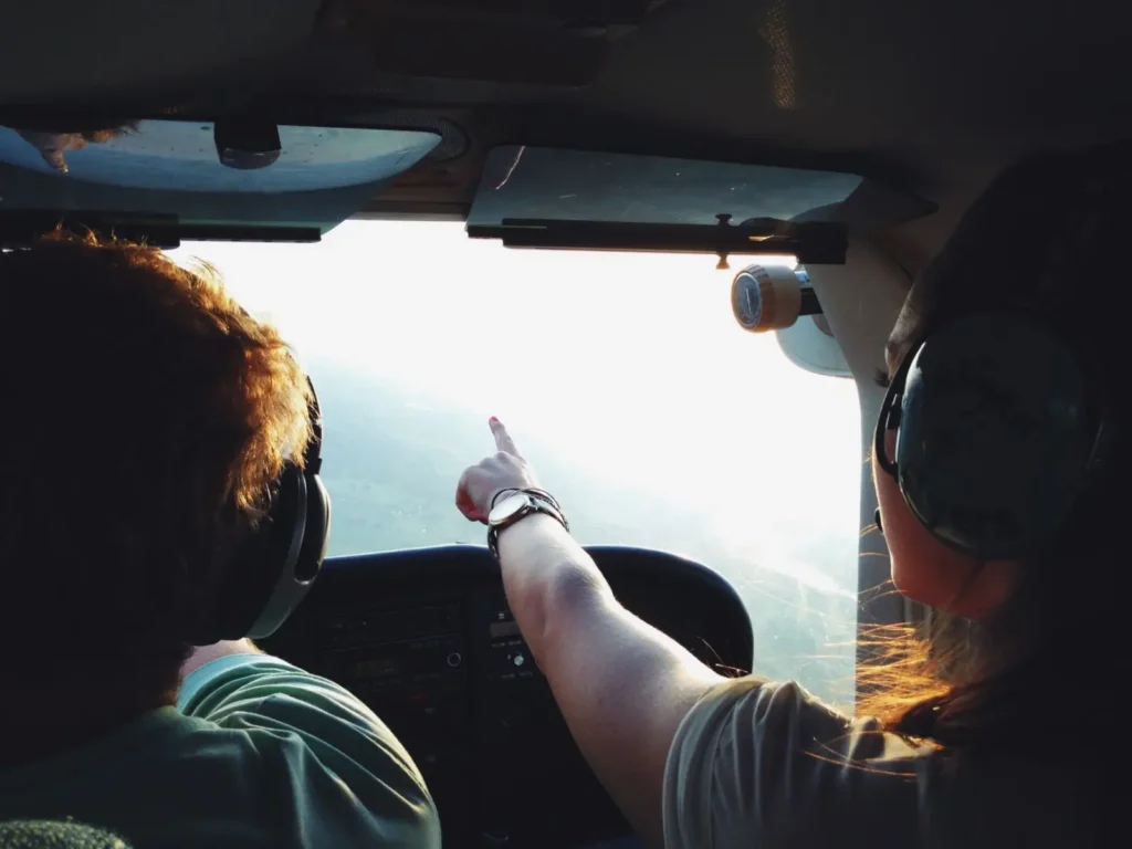 Small Group vs Private vs Large Group Tours: Which Is Right for You? ToursZoom A private tour guide and two travelers exploring an ancient temple with flexibility to customize their experience.