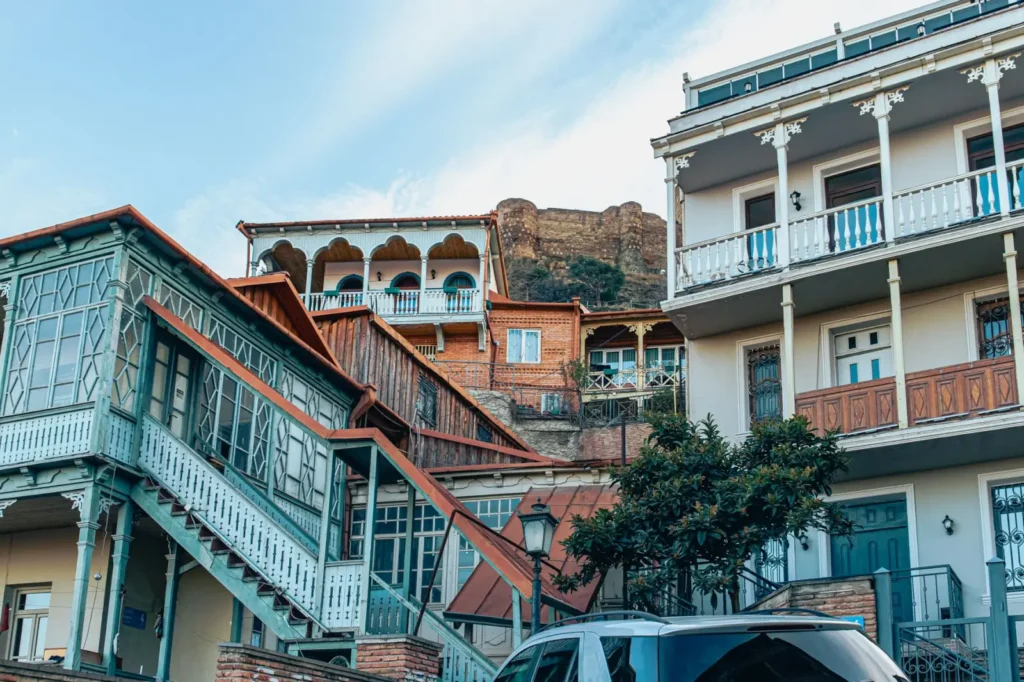 Travel Trends 2026: Where Travelers Are Going Next (and How to Plan It) ToursZoom Tbilisi's old town with its wooden balconies and Orthodox churches